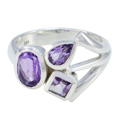 Saanvi purple gemstone trilogy ring with oval, pear, and square purple stones set in silver band