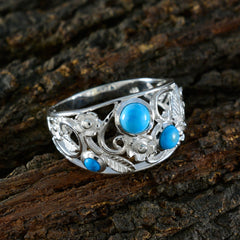 Meera silver ring with decorative floral design and turquoise stones turquoise trilogy ring