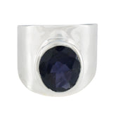 Camilla silver ring featuring a large blue solitaire statement ring with a faceted oval blue stone