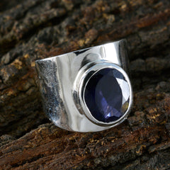 Camilla blue solitaire statement ring with large oval blue gemstone on silver band