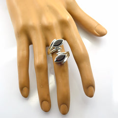 Emma contemporary red gemstone ring with silver band on display hand