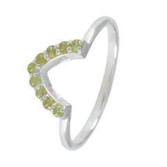 Naomi silver green gemstone crown ring with small round green stones in a crown shape