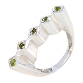 Ayesha silver green gemstone statement ring with five small green stones in a geometric design