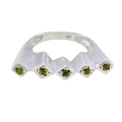 Ayesha green gemstone statement ring with five small green stones set in silver zigzag band
