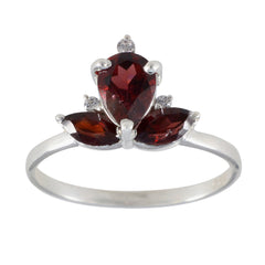 Liyana red gemstone trilogy ring with pear-shaped and marquise-cut red gemstones on silver band