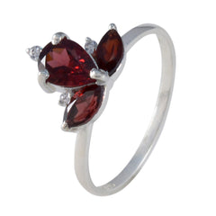 Liyana red gemstone trilogy ring with three deep red stones set in a silver band