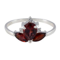 Liyana red gemstone trilogy ring with silver band and three deep red gemstones in elegant design