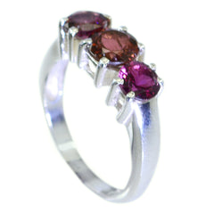 Hua red gemstone trilogy ring with three vibrant red gemstones set in silver band