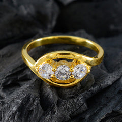 Yasmine gold ring featuring a white trilogy ring for women with three sparkling clear stones