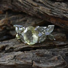 Sara yellow gemstone floral ring with oval center stone and leaf-shaped accents on silver band