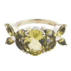 Sara yellow gemstone floral ring featuring an oval center stone with floral cluster design