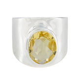 Camila yellow solitaire statement ring with wide silver band and faceted yellow gemstone