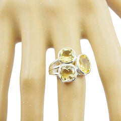 Savannah yellow trilogy gemstone ring with three yellow stones set on a silver band worn on finger