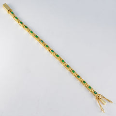 Laura Rakhi Eye-catching Green Tennis Bracelet