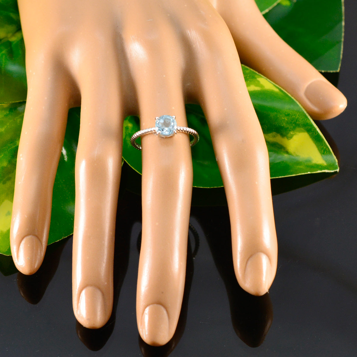 Jiwoo Twist Blue Solitaire Ring