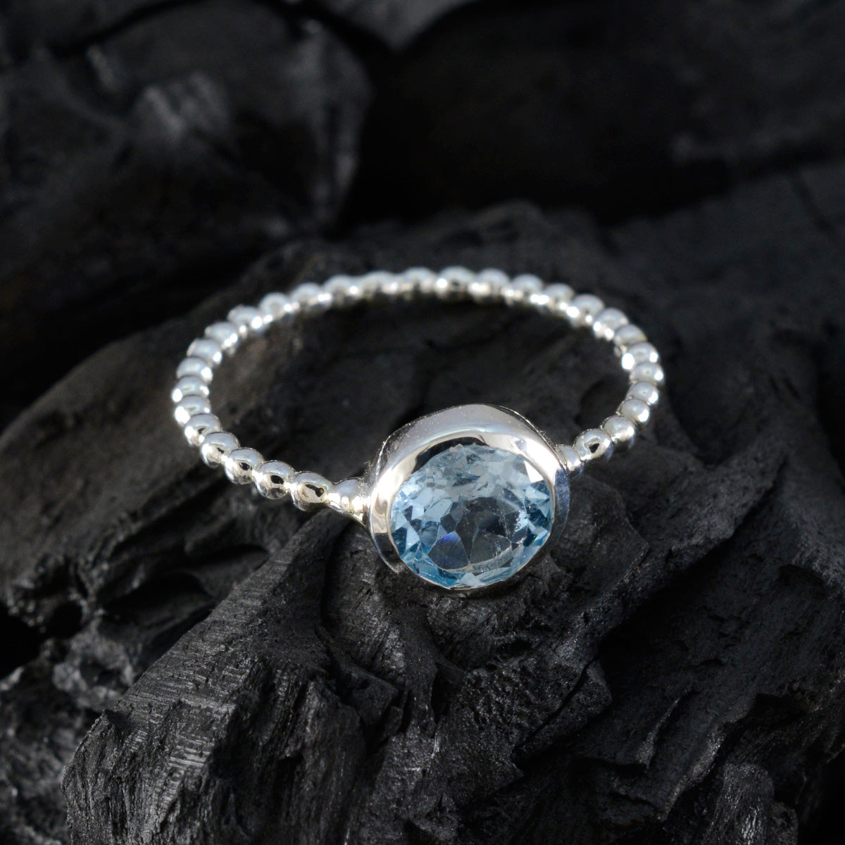 Rina Twist Blue Solitaire Ring