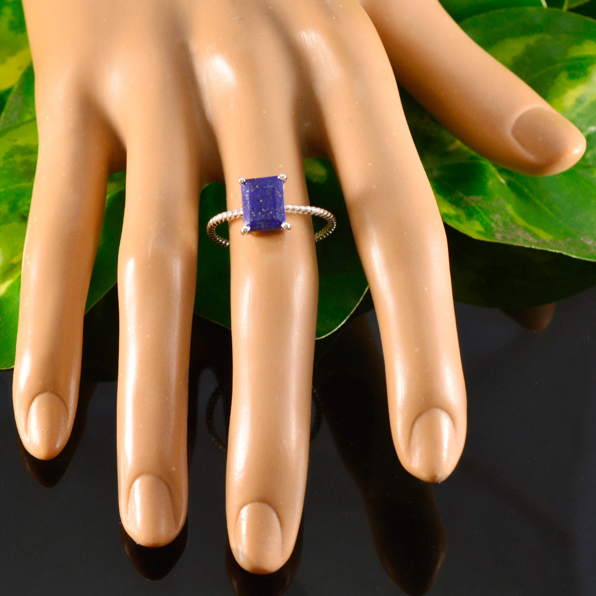Emi Twist Blue Solitaire Ring