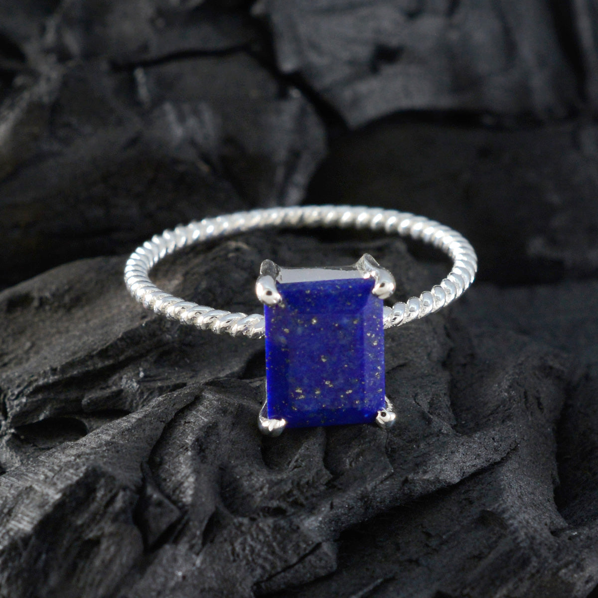 Emi Twist Blue Solitaire Ring
