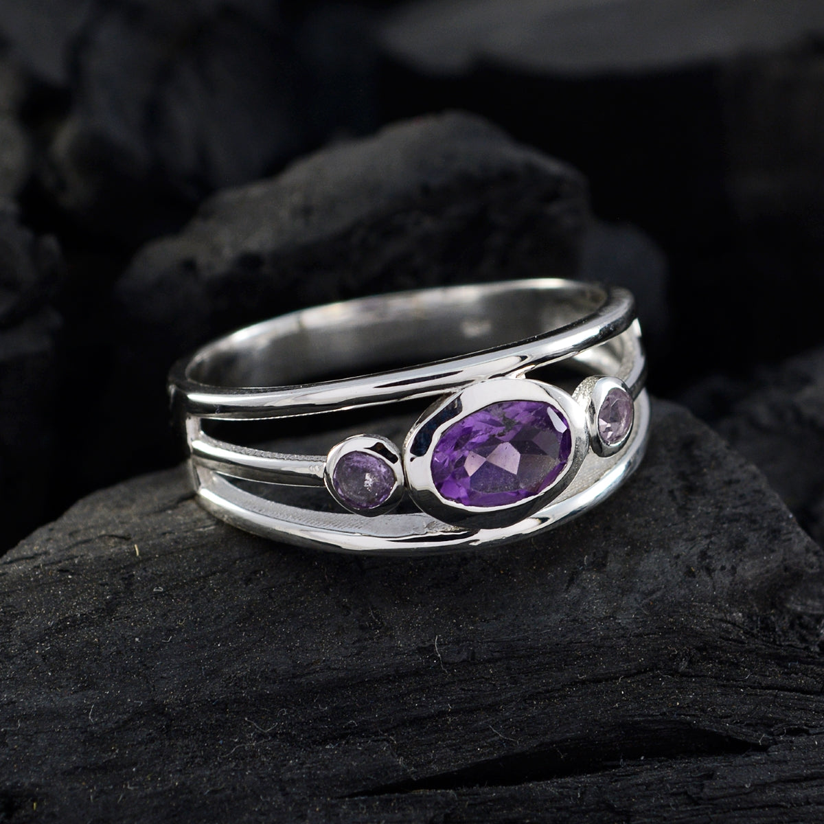 Silver ring featuring an abstract purple gemstone ring design with three purple stones by Tereza