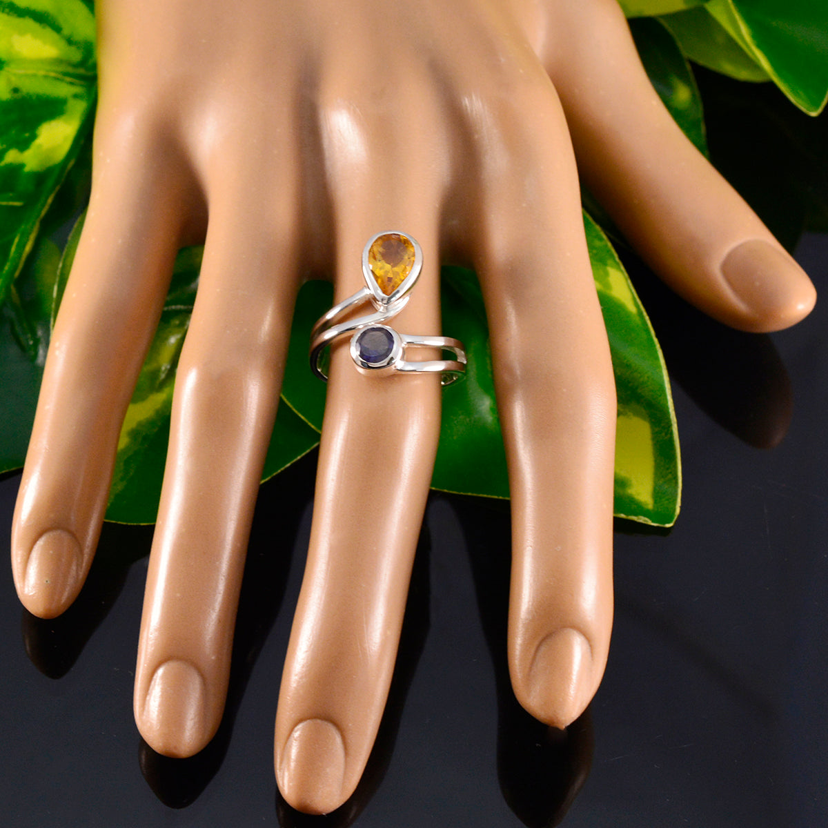Ines artisan multicolor toi et moi ring with yellow and blue gemstones on display hand
