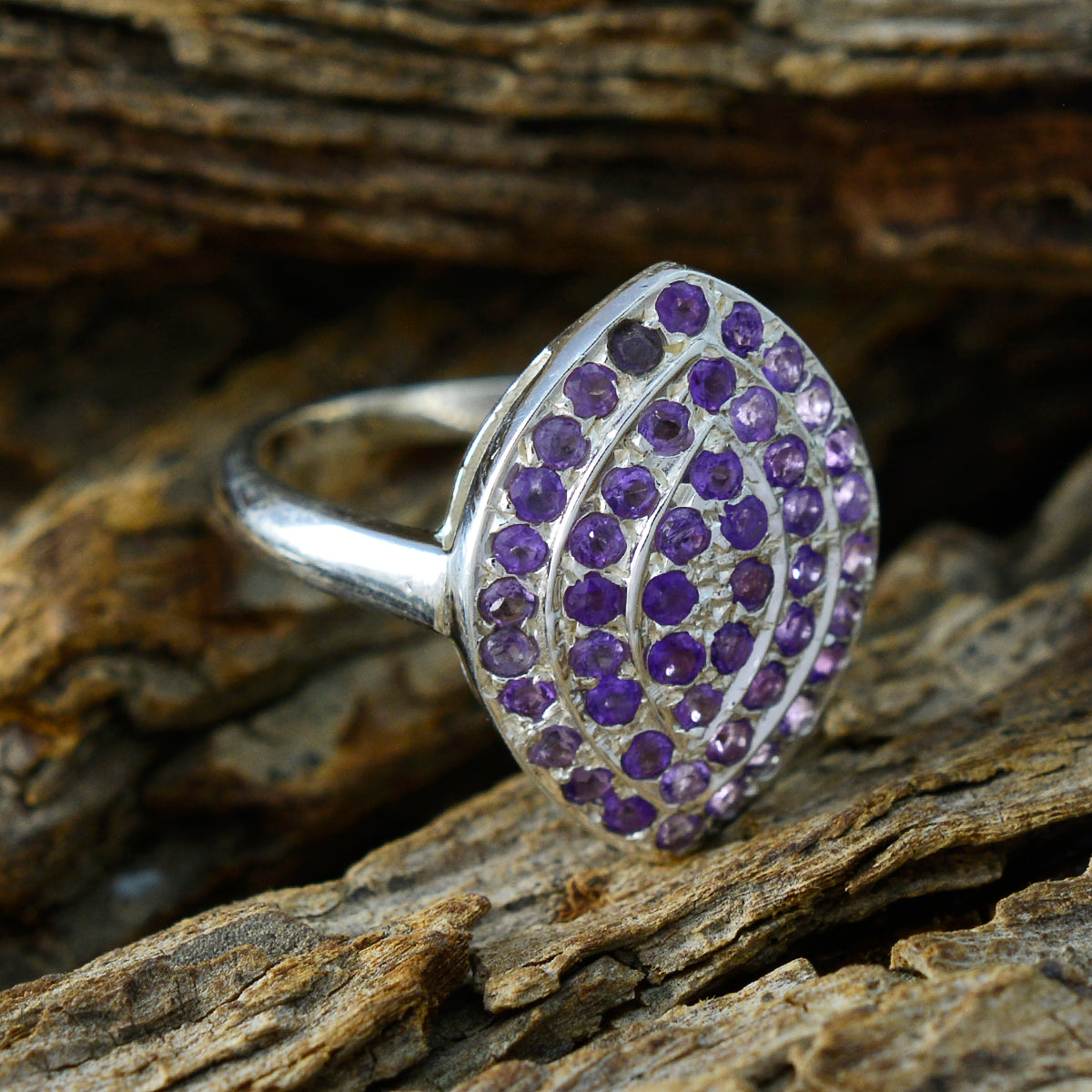 Priya abstract purple gemstone ring in sterling silver with clustered round purple stones on textured band