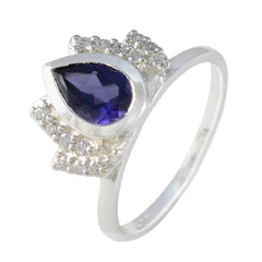 Dewi blue gemstone halo ring with pear-shaped blue stone and silver band