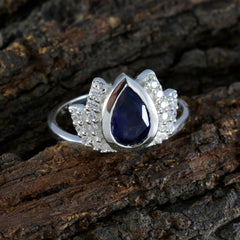 Dewi blue gemstone halo ring with teardrop-shaped center stone and surrounding small diamonds