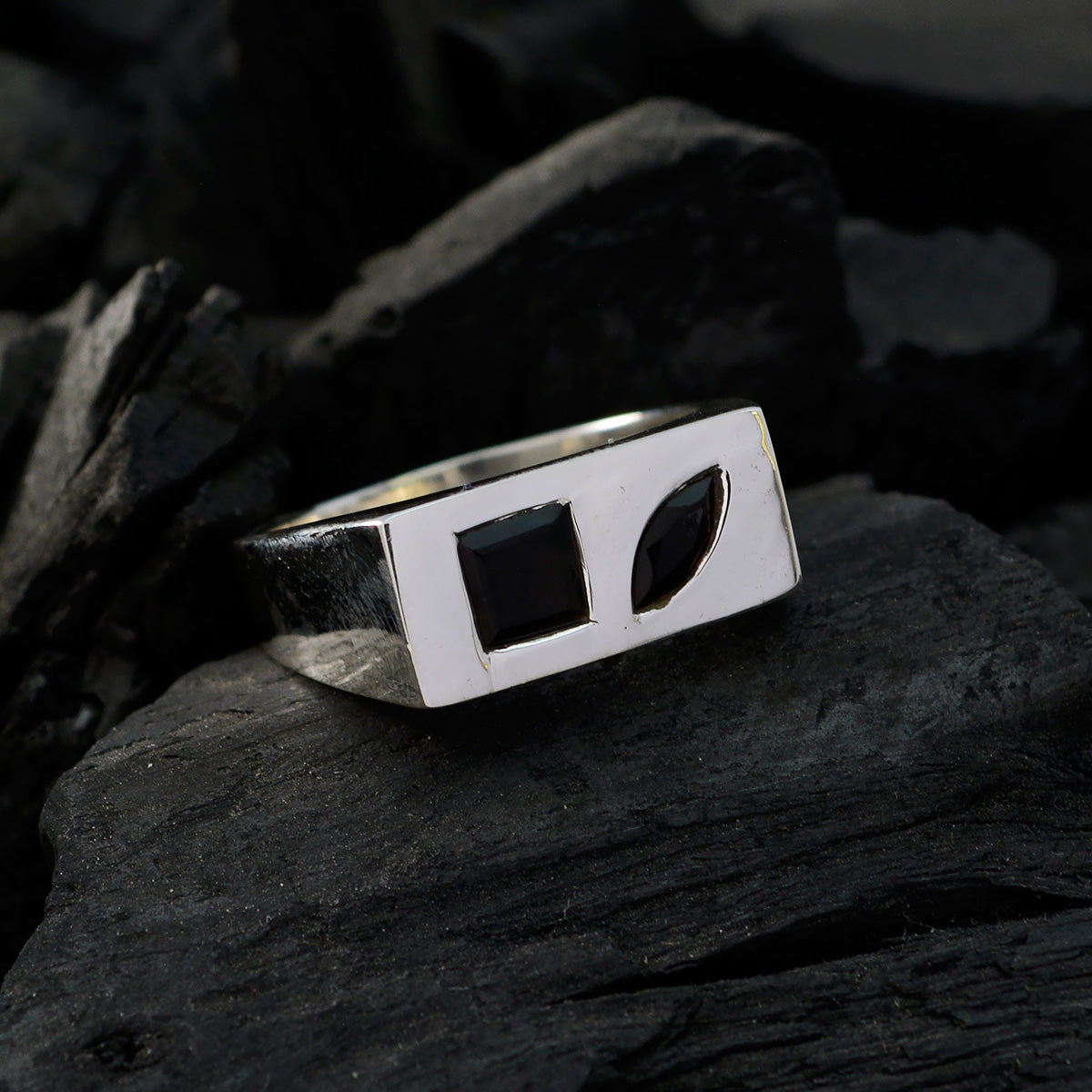 Violet silver boho toi et moi ring with black square and leaf-shaped stones on dark textured surface