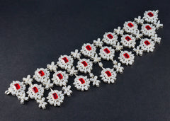 Lakshmi bridal red stone necklace adorned with intricate silver floral designs