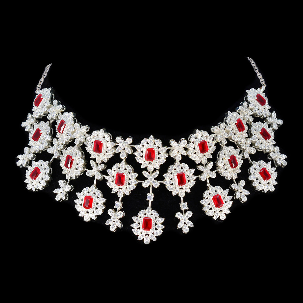 Lakshmi bridal red stone necklace featuring intricate flower designs with sparkling red stones