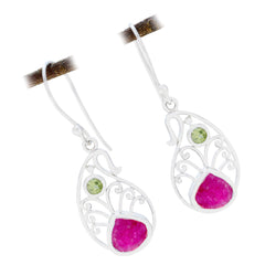 Zoey colorful party earrings with intricate silver design and pink and green stone accents