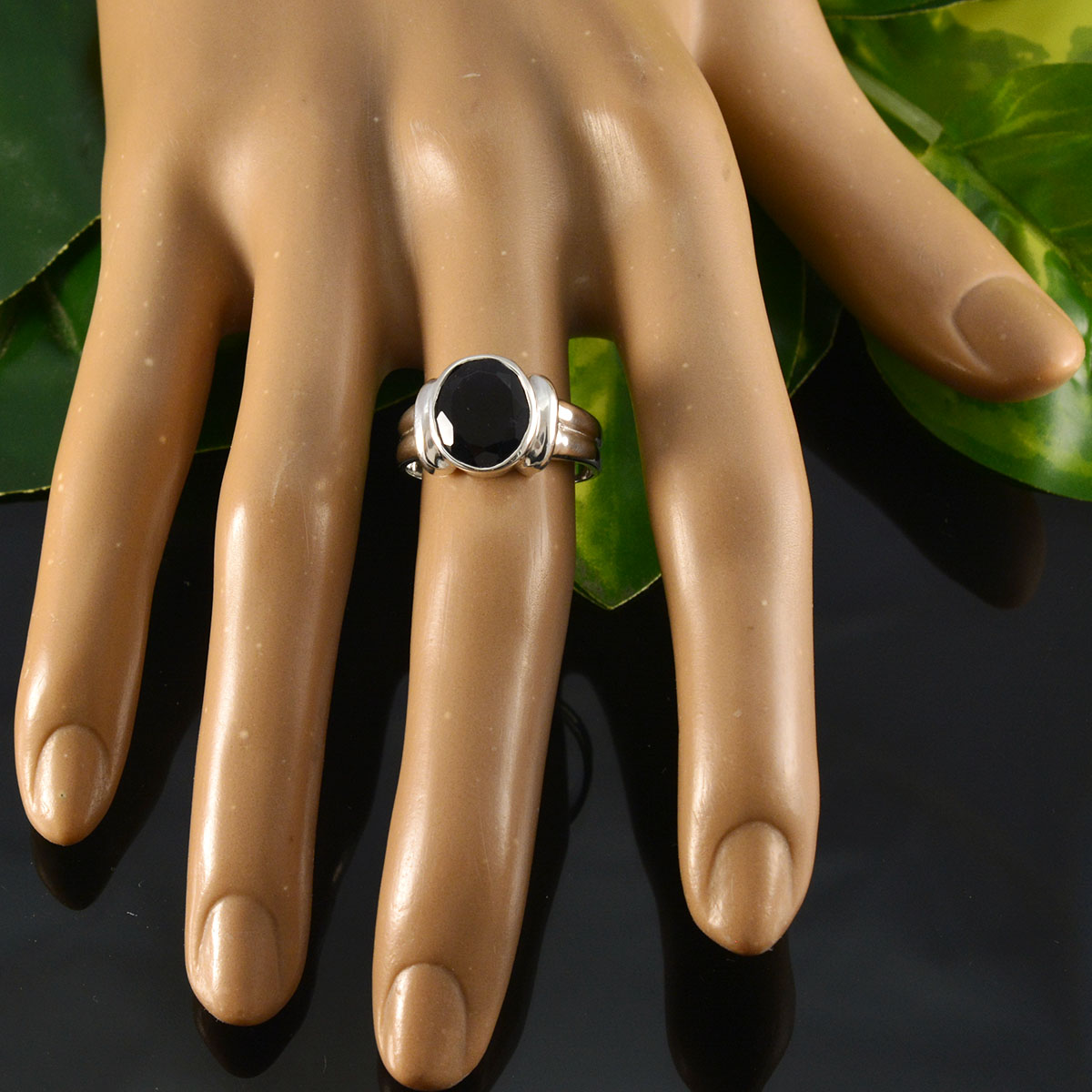 Modern Blue Solitaire Ring featured on a hand display with a sleek design and bold blue gemstone