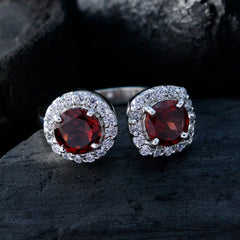 Elegant red toi et moi ring featuring round red stones and sparkling cubic zirconia accents