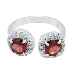 Red toi et moi ring featuring two vibrant red gemstones surrounded by sparkling clear stones