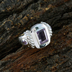 Valentina abstract purple gemstone ring with silver twisted band on textured bark background