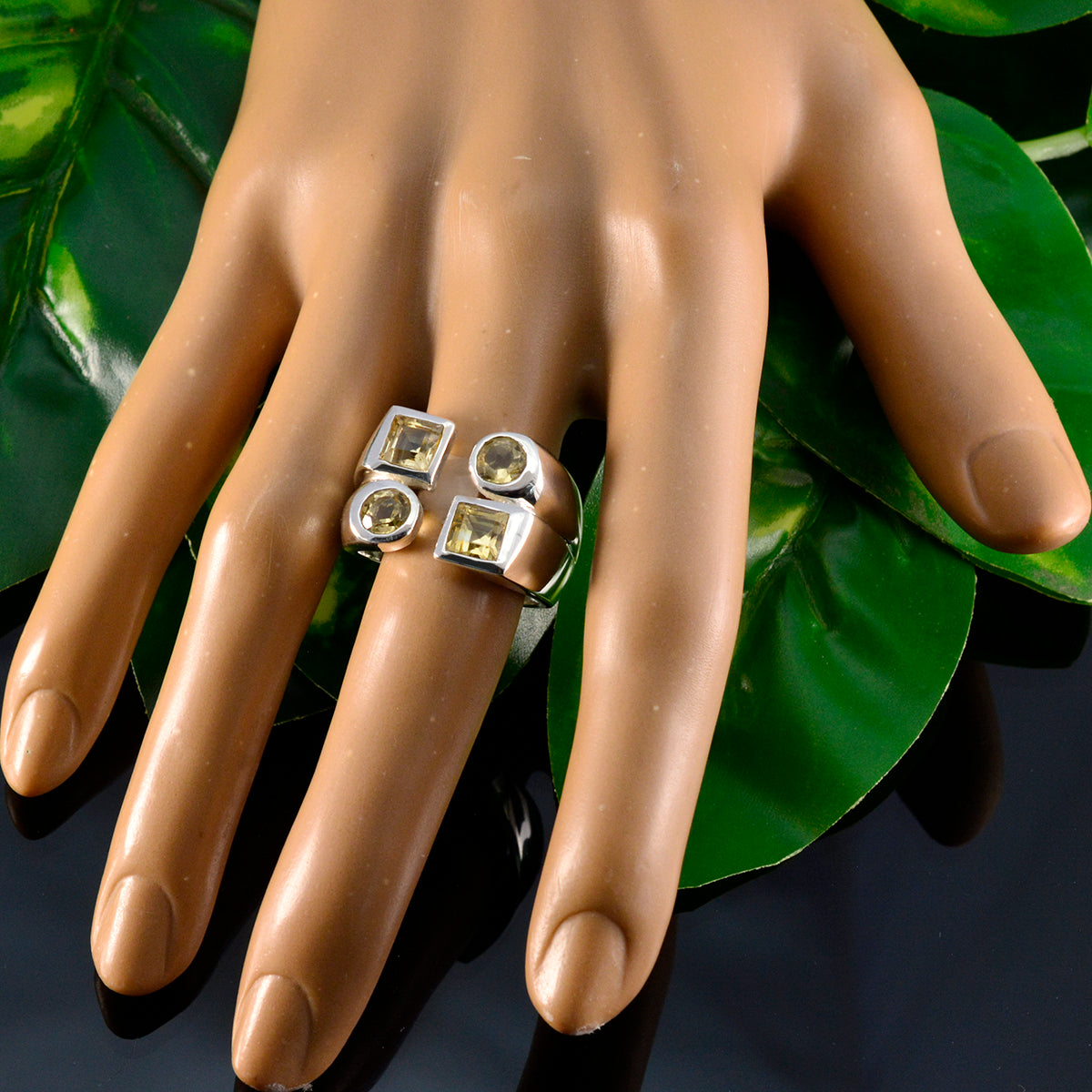 Nella antique yellow gemstone ring with four square and round yellow stones on silver band displayed on mannequin hand