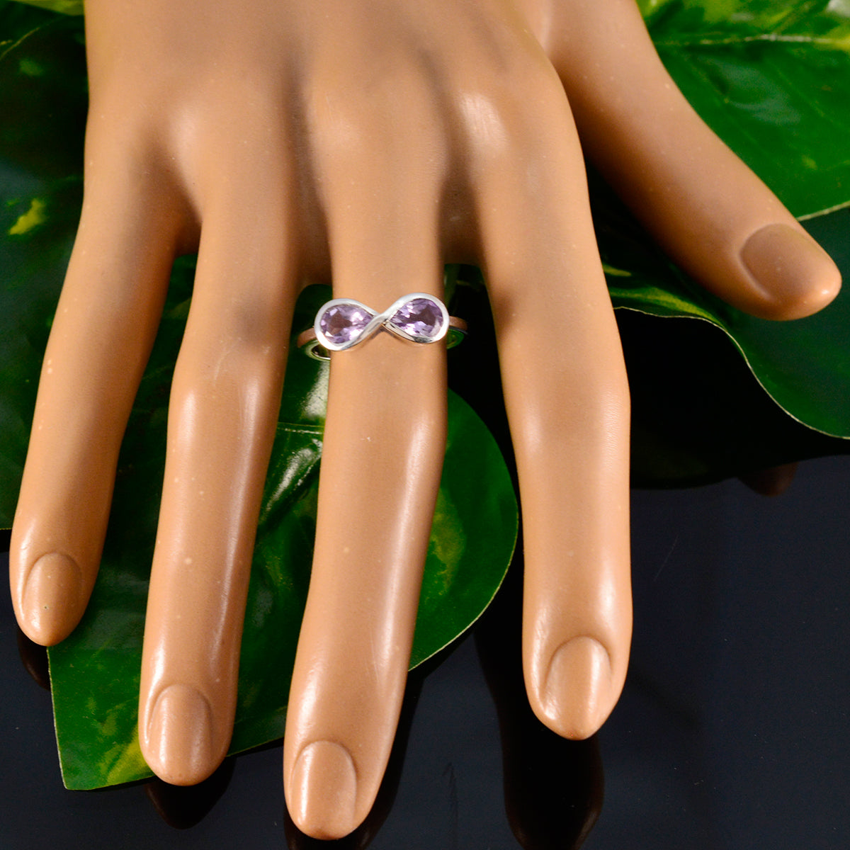 Haruka artisan purple gemstone ring with two teardrop amethyst stones on display hand