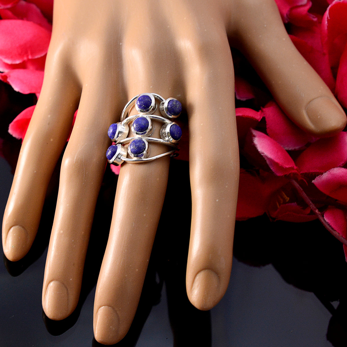 Andrea blue gemstone statement ring with multiple round blue stones set on silver bands