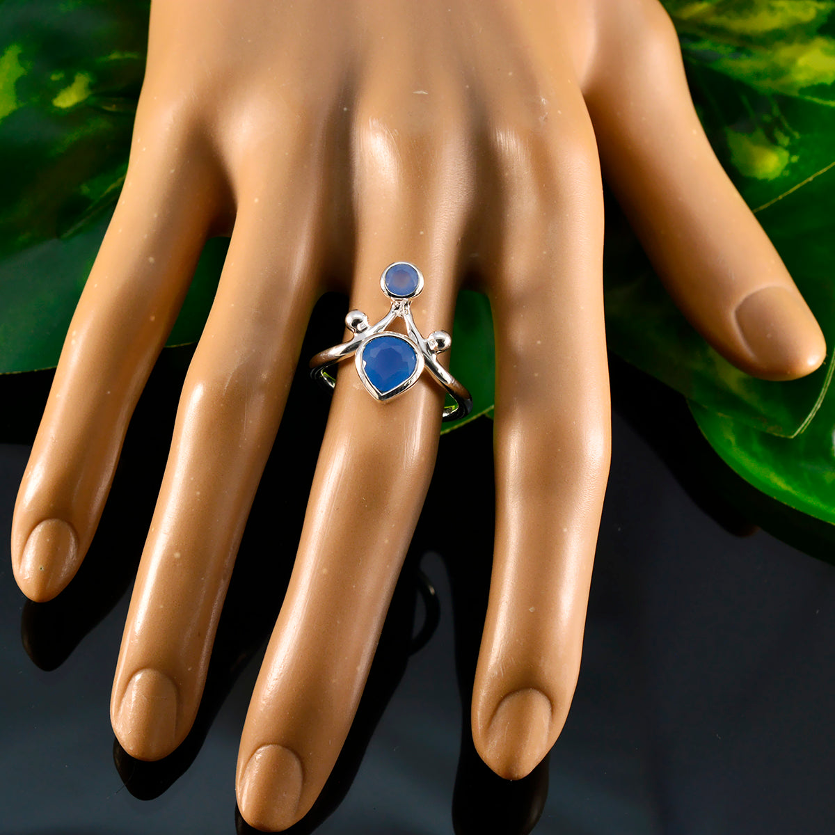 Riley blue gemstone toi et moi ring with two blue stones set in silver band on hand display