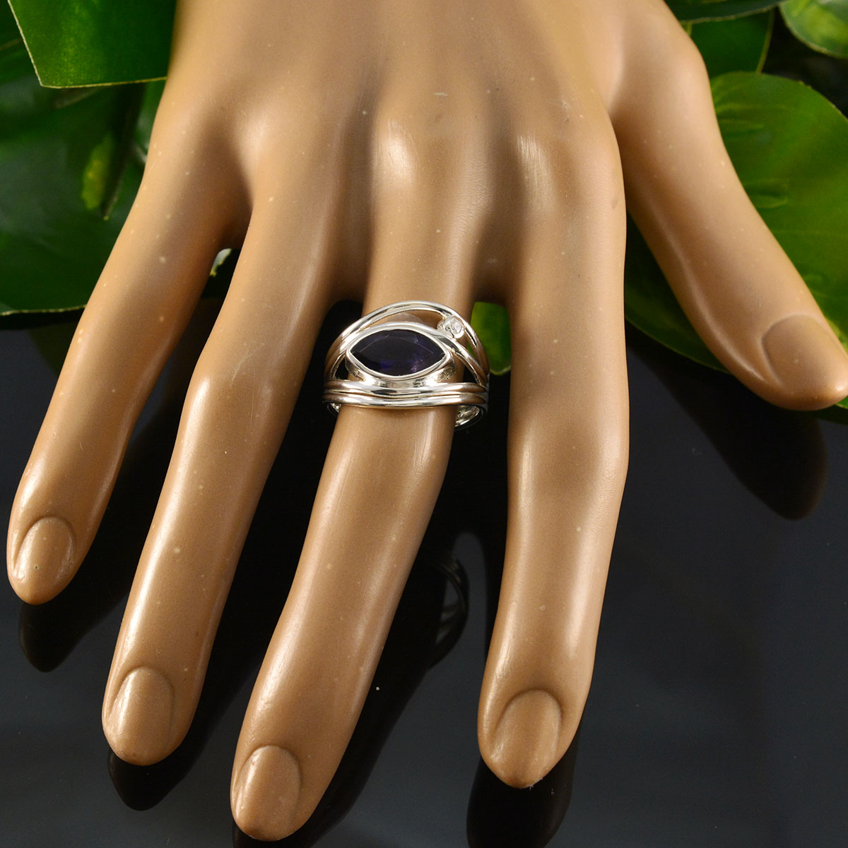 Stella boho blue toi et moi ring with silver band and blue stone displayed on hand model