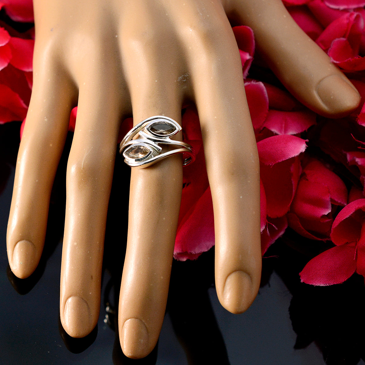 Natalia brown toi et moi ring with two marquise brown stones on silver band displayed on mannequin hand