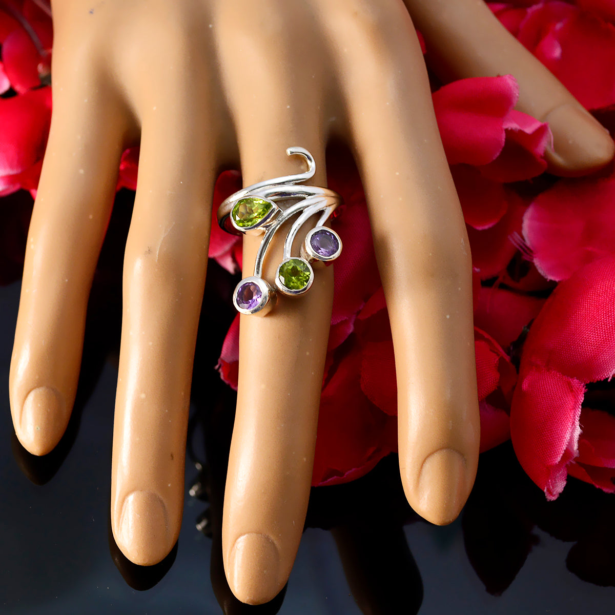 Natalie contemporary multicolor gemstone ring with green and purple stones on display hand