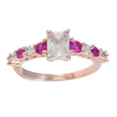 Teresa rose gold ring with emerald cut center stone and alternating red gemstones and diamonds contemporary red gemstone ring