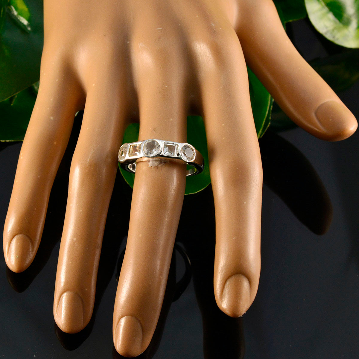 Bruna contemporary white gemstone ring silver band with bezel set round and rectangular stones on mannequin hand