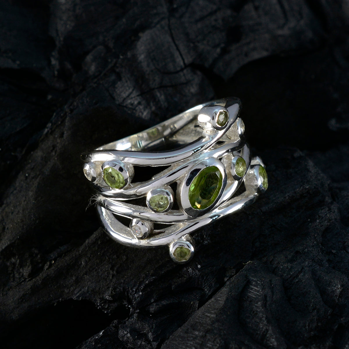 Nisa fairytale brown gemstone ring shown as silver multi band ring set with green peridot gemstones