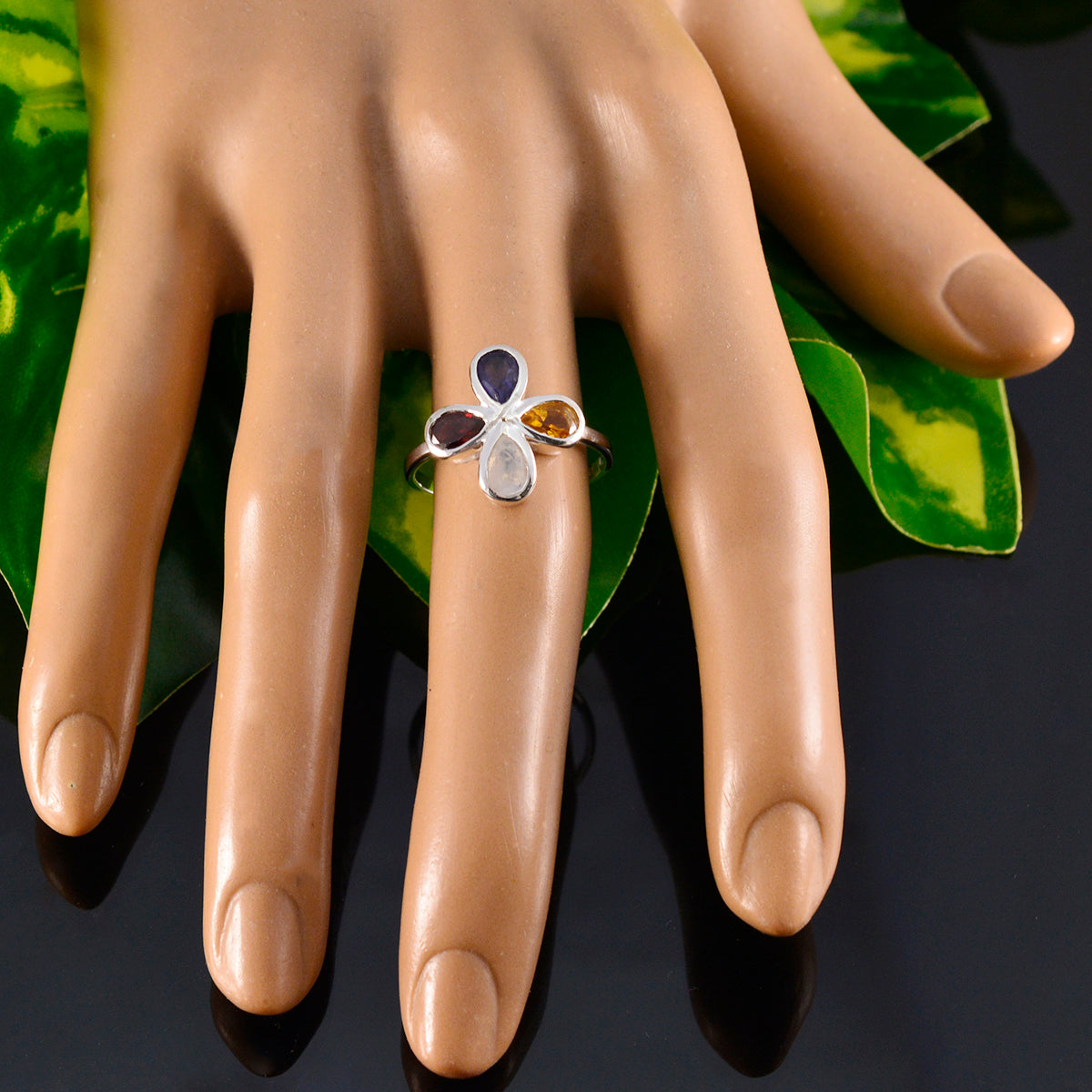 Olivia silver floral multicolor gemstone ring with four teardrop stones on mannequin hand