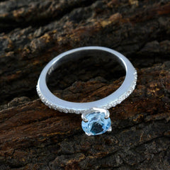 Maria silver ring featuring a sparkling blue halo ring design with a central blue gemstone