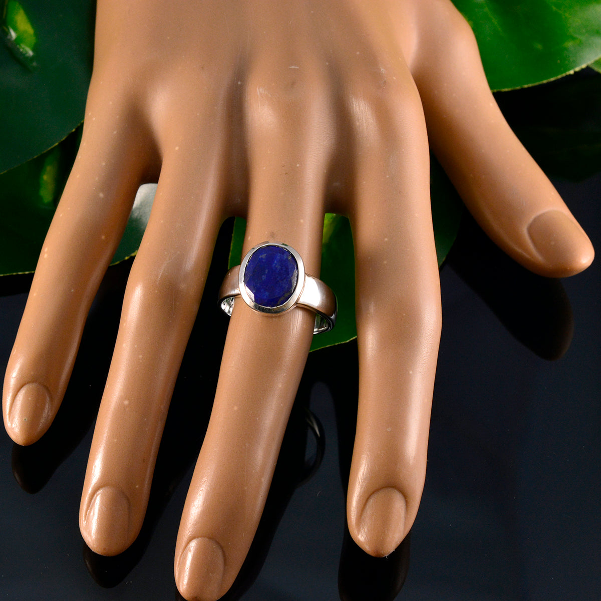 Chloe blue solitaire ring for women with a round blue gemstone set in a silver band