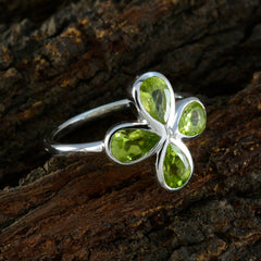 Liyana green gemstone floral ring in sterling silver with four peridot petals nature inspired design