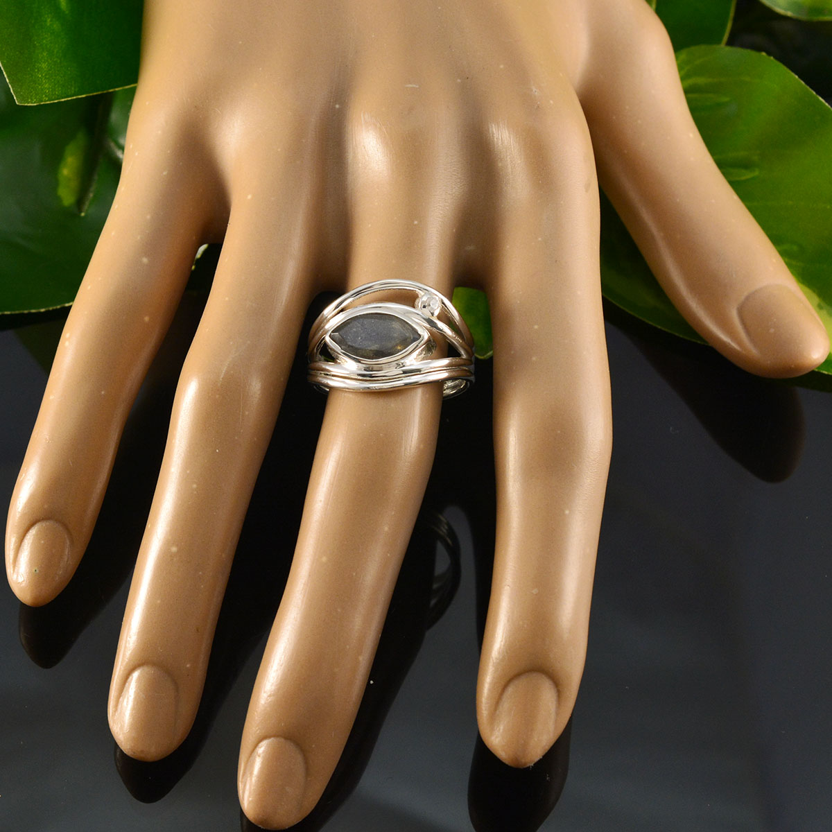 Valentina grey toi et moi ring with marquise grey stone and twisted sterling silver bands on display hand